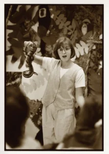 Sepia photo of a Zoo educator holding a snake and educating children in the education complex at the Pittsburgh Zoo & Aquarium. The photo was taken in the 1990's. 